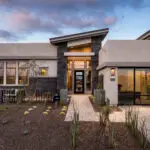 Custom front yard design with organized planting, brick paver walkway and desert contemporary vibes.