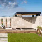 Custom backyard design with cantilevered rain curtain, multiple seating areas and raised, private spa.