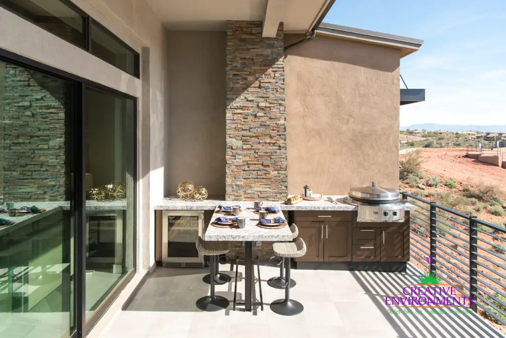Backyard design with outdoor kitchen, wine fridge and outdoor dining area.
