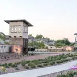Custom community entrance with organized planting, roundabout and cantilevered planting.