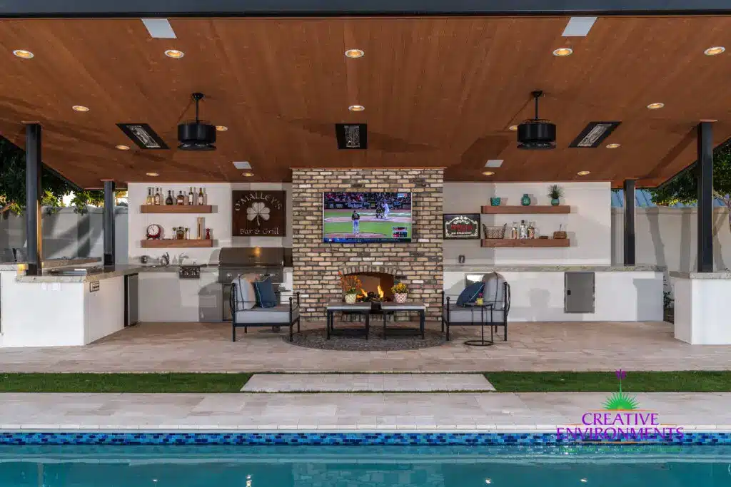 Custom backyard design with deco-tile pool, recessed lighting and outdoor BBQ.