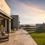 Backyard design with natural stone and artificial turf