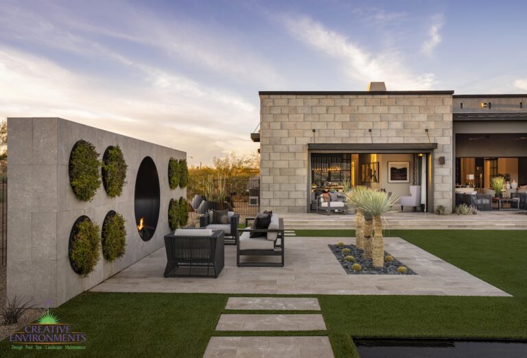 Backyard design with circular living wall, multiple seating areas and artificial turf.