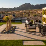 Custom backyard design with natural stone steps and circular living wall and fire feature.