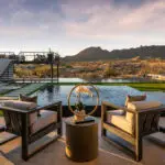 Backyard design with two-story shade structure and pool