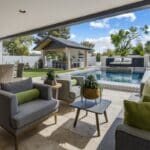 Custom backyard design with multiple seating areas, black water wall and deco-tile pool.