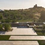Custom backyard design with mountain views, annuals and step lighting.