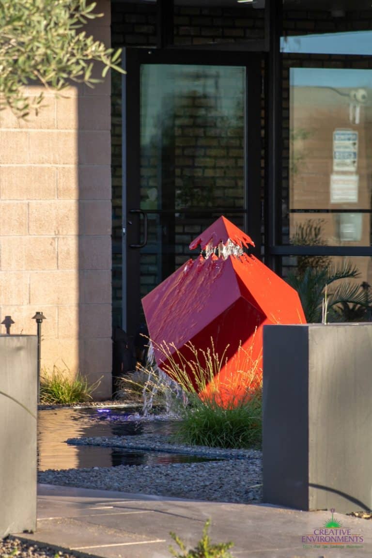 Custom water feature design in the front of Creative Environments Headquarters.