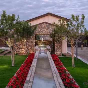 7379Entry(LOGO) Custom community amenities with linear water feature, tree uplighting and organized planting.