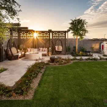 Cadence_Rumford_Backyard_3855LOGO Custom backyard design with real grass, cantilevered shade structure with hanging swings and up lighting.