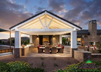 Custom community amenities with shade structure, outdoor dining area and fireplace.
