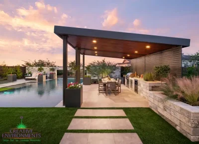 Backyard design with angled shade structure and natural stone steps.