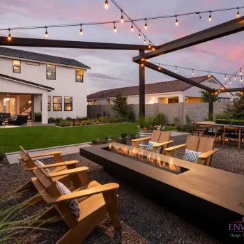 Preserve_at_San_Tan_Laurens_BKElevation_5921(LOGO) Backyard design with string lights, real grass and fire table.