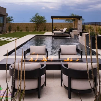 Reserves_Backyard_8207LOGO Custom backyard design metal shade structure, multiple seating areas and metal scupper water features.