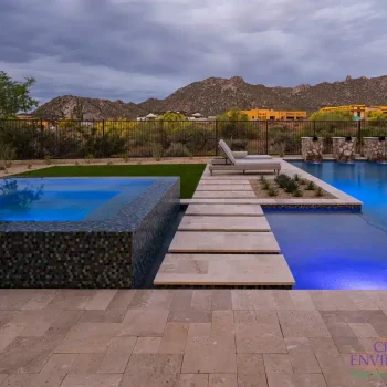 Residence 6 (6) Custom backyard design blue raised spa, blue pool and water columns.