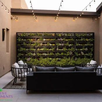 Residence 7 (2) Custom courtyard design with succulent living wall, string lights and outdoor seating area.