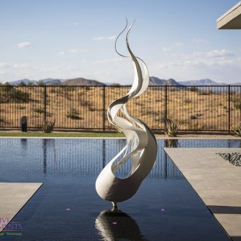 Storyrock_Pool_5560LOGO Custom backyard design with zero-edge pool, metal statue in pool and custom metal work.