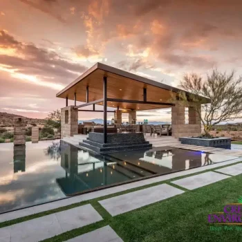Talon Ranch (1) Custom backyard design with baja step in pool and angled shade structure next to pool.