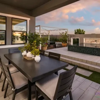 Tapestry_At_Destination_Stanfield_Patio_3959(LOGO) Custom backyard design with outdoor dining area and string lights.