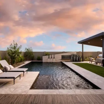 Tapestry_At_Destination_Upland_Backyard_9271(LOGO) Custom backyard design with multiple seating areas and water feature into pool.