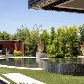 The Ariane at Flora at Morrison Ranch (7) Custom backyard design with circular raised spa, circular pool and privacy hedges.