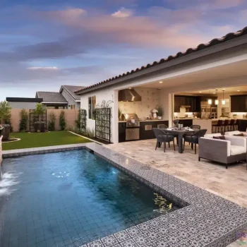 The Potomac (1) Custom backyard design with deco-tile pool, metal trellis and outdoor kitchen.