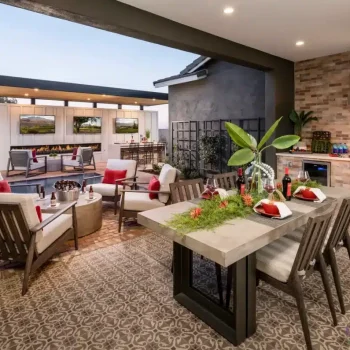 The St Helena (3) Custom backyard design with multiple seating areas, outdoor kitchen and cantilevered shade structure with multiple outdoor TVs.