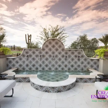 Turquesa courtyard water feature Custom backyard design with deco-tile water feature, Spanish design style and outdoor seating area.