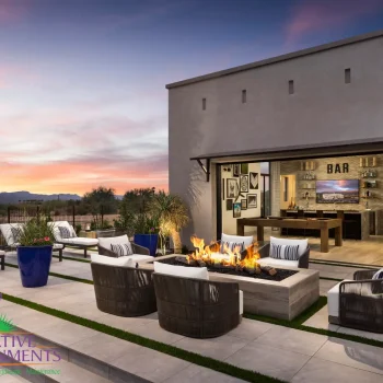 Verde River Model Fire feature Custom backyard with seamless indoor/outdoor design, multiple seating areas and fire table.