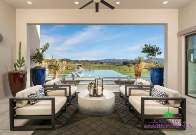 Custom backyard design with metal accents, large planters and zero edge pool with baja step.