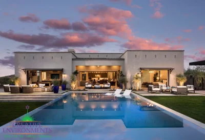 Custom backyard design with artificial turf, acrylic pool and baja step.