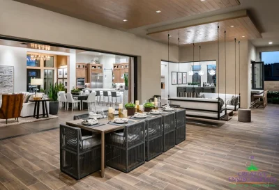 Custom backyard design with hanging seating, outdoor dining area and indoor/outdoor design fusion.