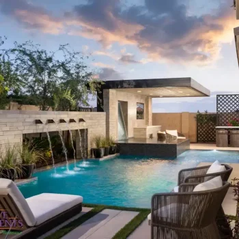 the sapphire 2 Custom backyard design with cantilevered shade structure and metal scupper water feature into unique-shaped pool.